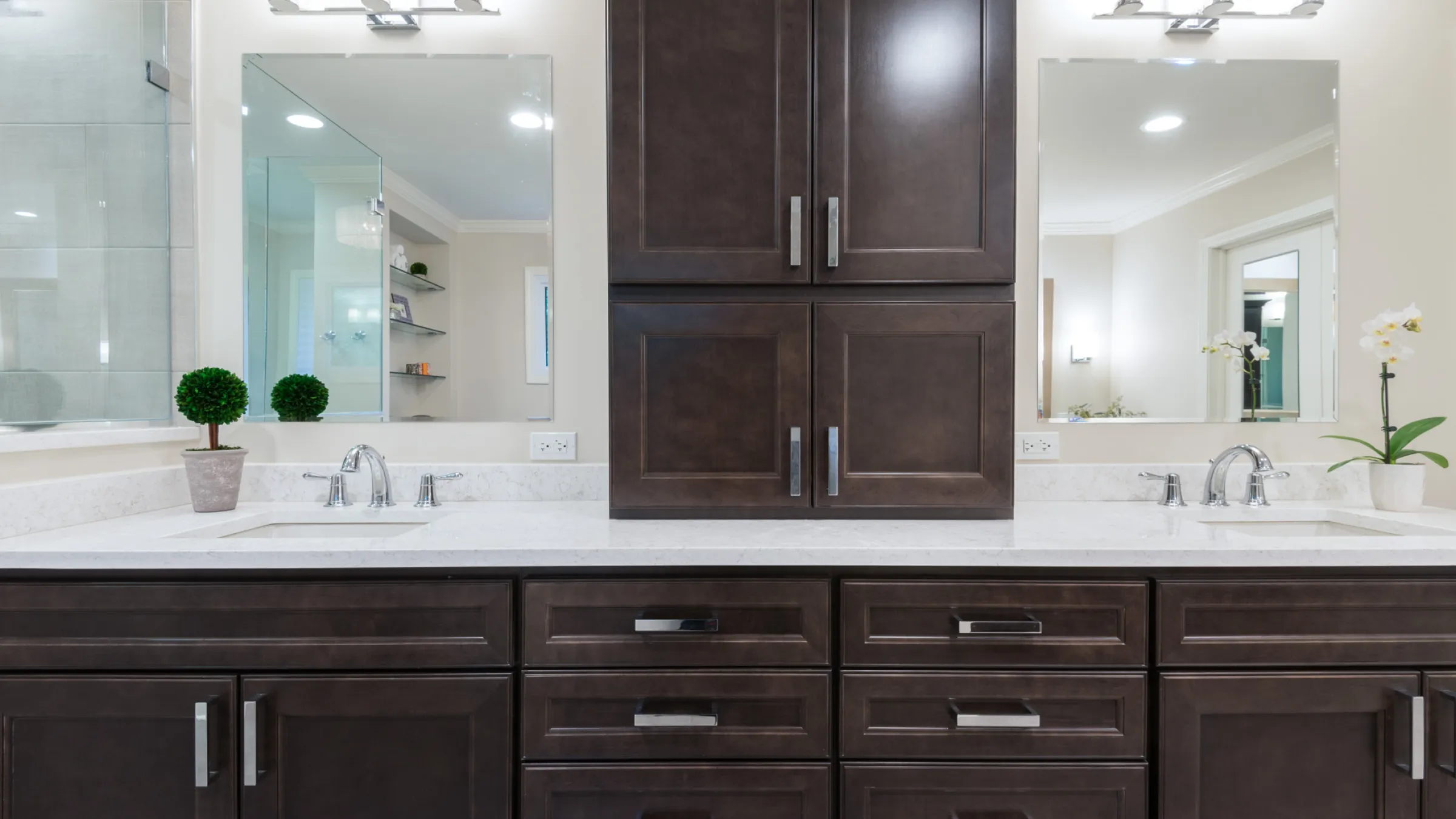 Modern bathroom remodel featuring dark wood cabinets, white quartz countertop, dual sinks, and rectangular mirrors in Palatin