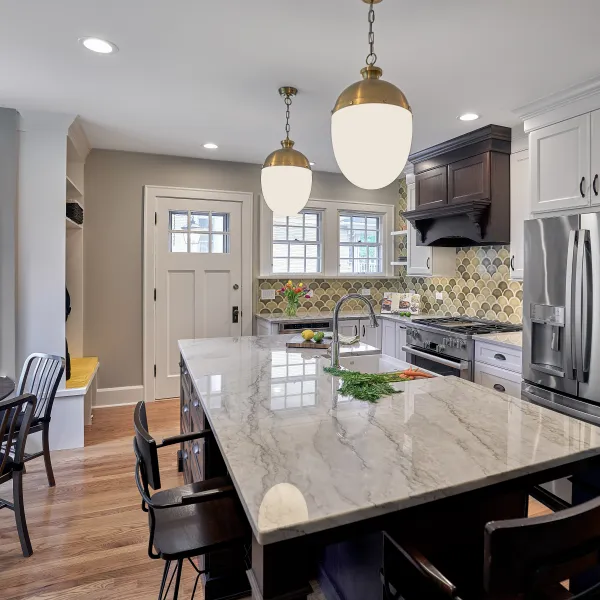 Arlington Heights kitchen remodel: Marble island, stainless steel appliances, custom cabinets, and wood floors.
