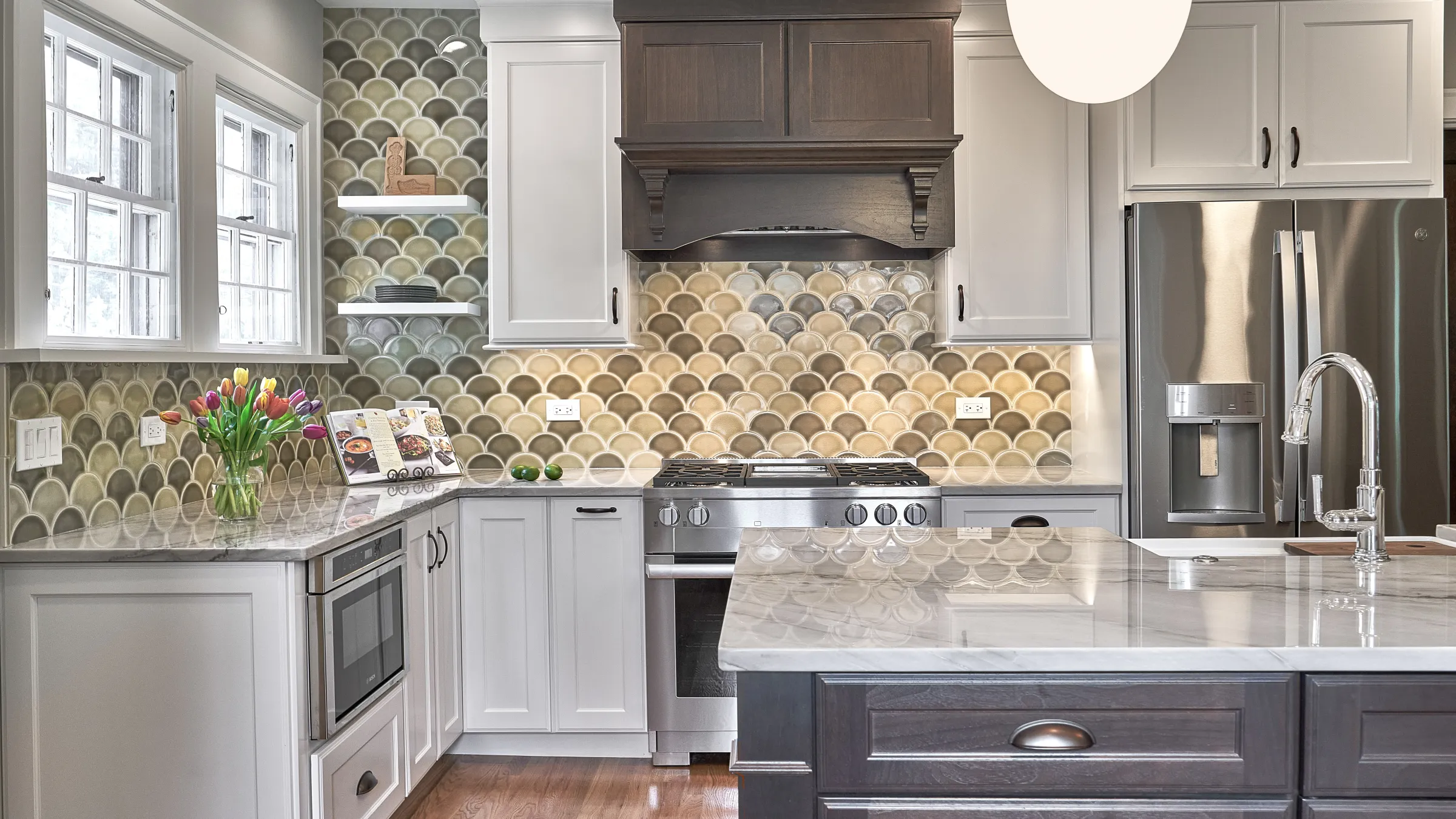 Arlington Heights kitchen remodel: Custom cabinets, marble countertops, unique backsplash, stainless steel appliances.