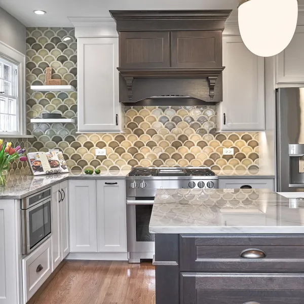 Arlington Heights kitchen remodel: Custom cabinets, marble countertops, unique backsplash, stainless steel appliances.