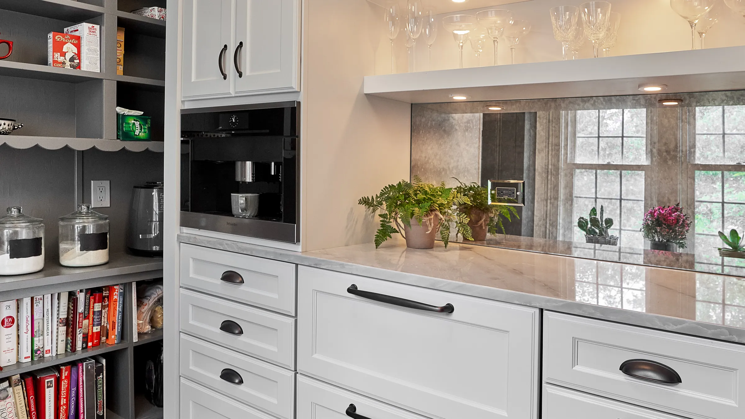 Arlington Heights kitchen remodel featuring custom white cabinets, marble countertop, and built-in Miele coffee maker.