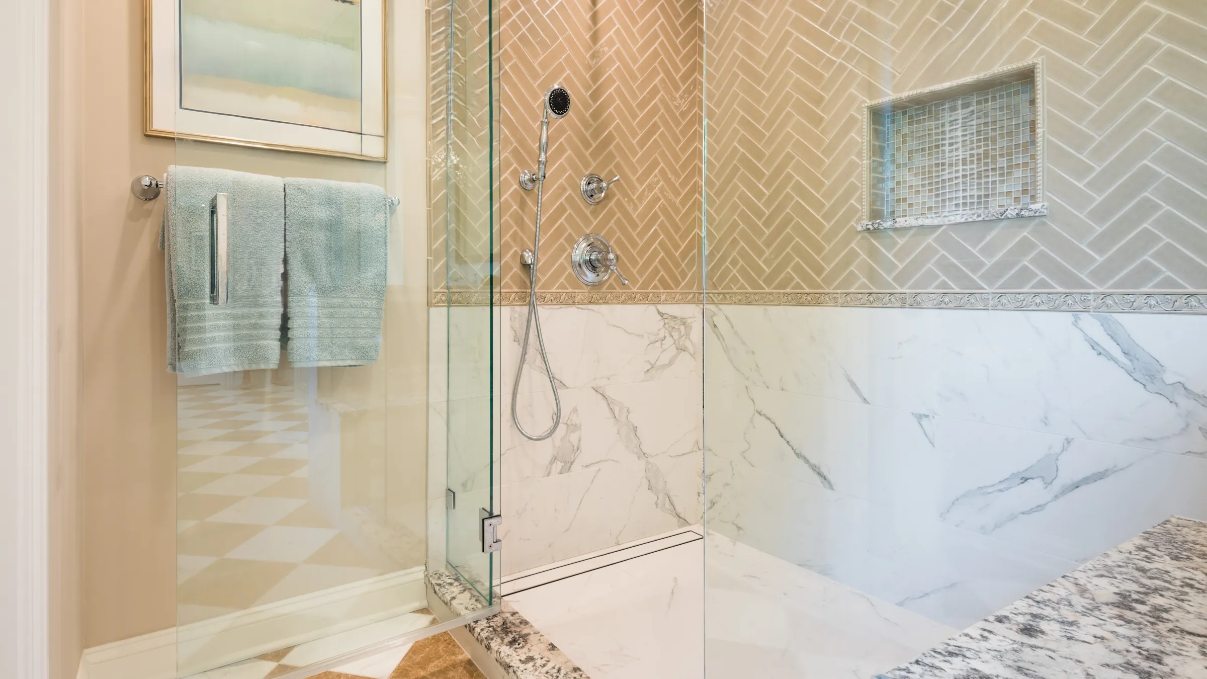 Luxury primary bath remodel featuring custom tile shower, marble accents, and elegant fixtures.
