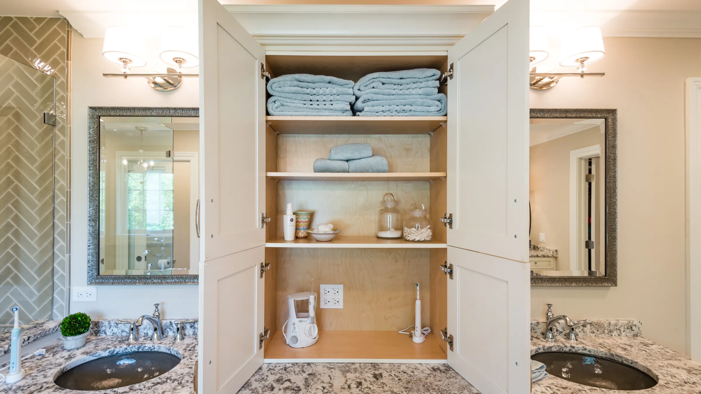 Palatine bathroom remodel featuring custom cabinets, granite counters, and tile work by GS Construction.