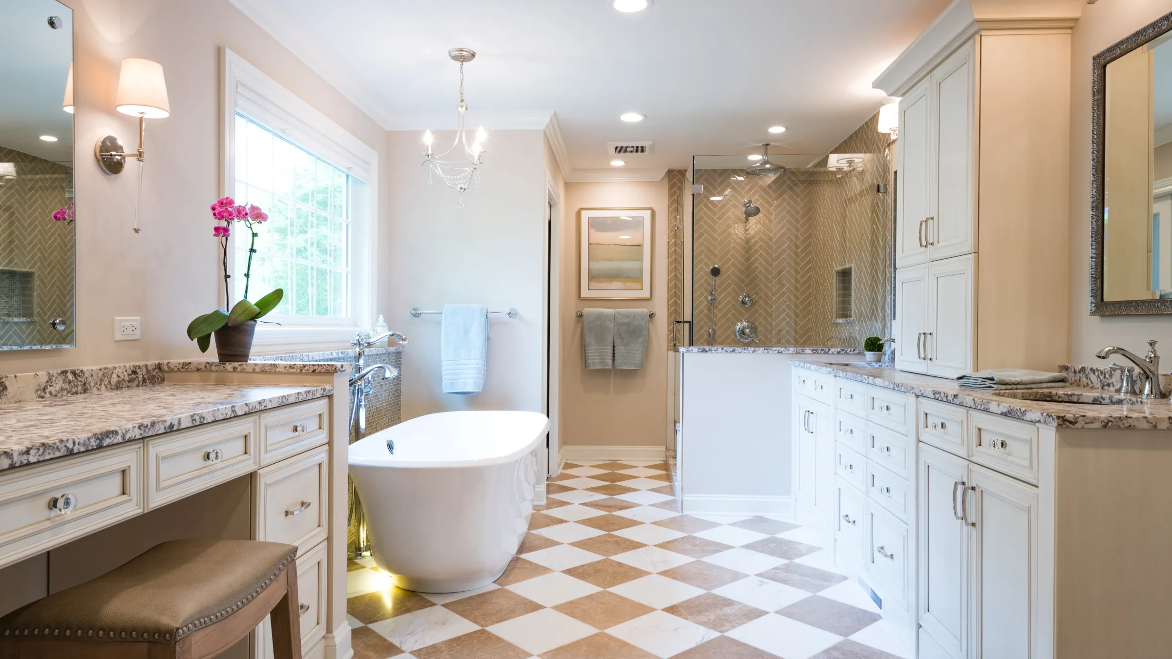 Luxurious bathroom remodel in Palatine, IL featuring custom cabinets, granite countertops, and a freestanding tub.
