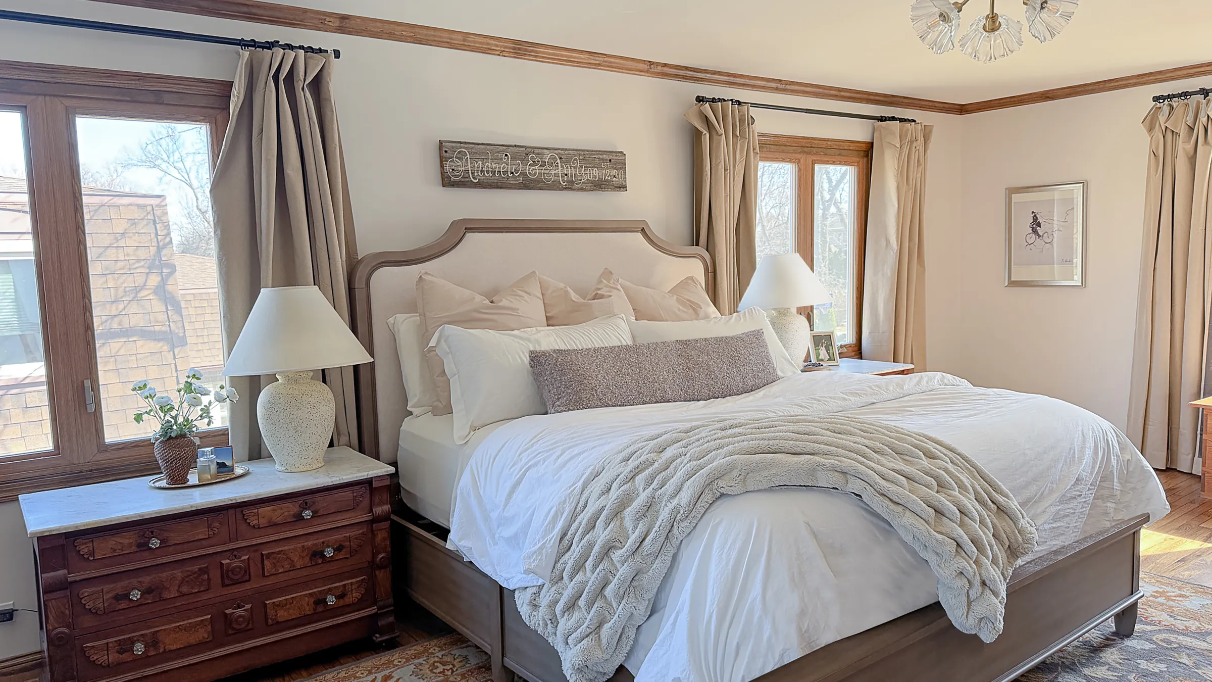 Arlington Heights bedroom with custom bed, wood trim, and neutral decor.