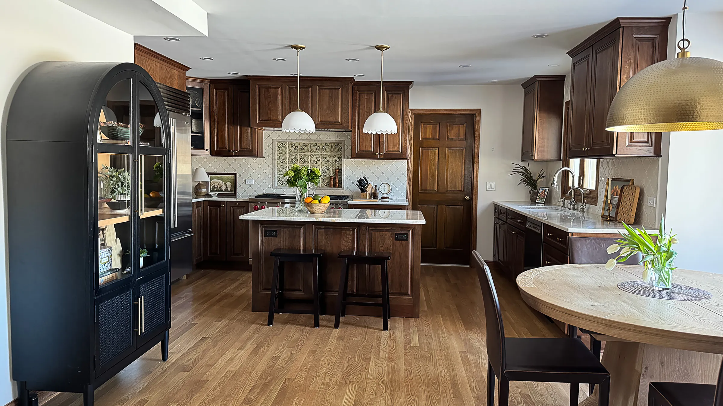 Arlington Heights kitchen remodel: wood cabinets, white countertops, island, and hardwood floors.