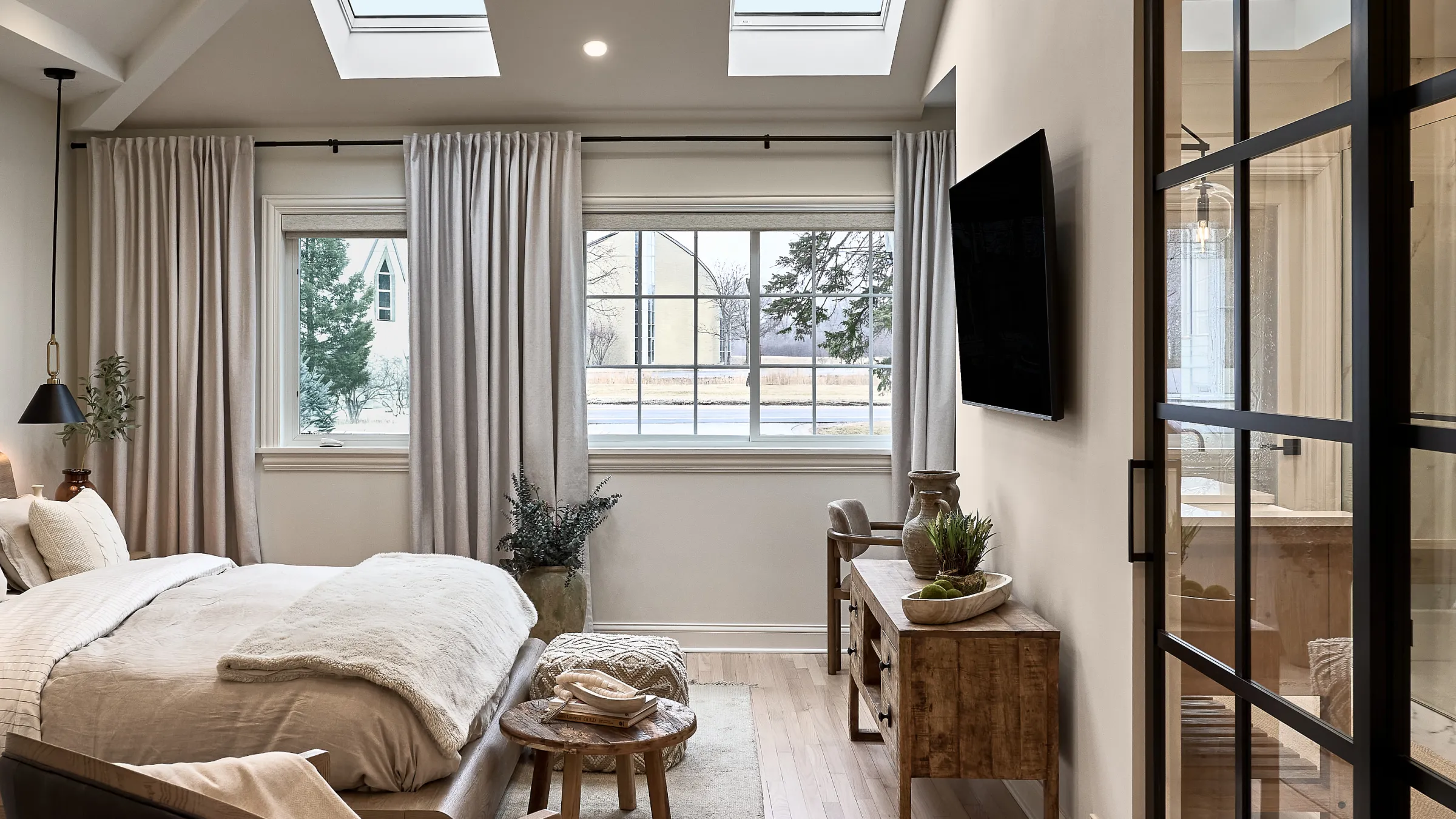 Prospect Heights bedroom remodel with wood floors, custom console table, and natural light. Modern design.