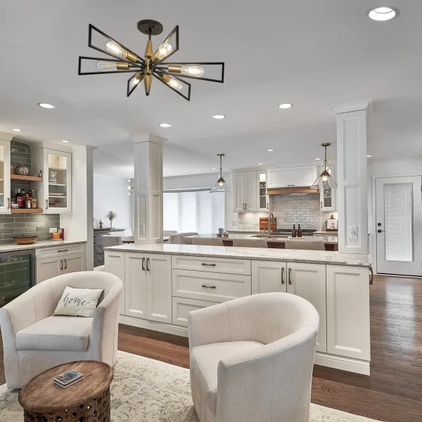 Arlington Heights kitchen remodel with white cabinets, hardwood floors, island seating, & modern light fixture.