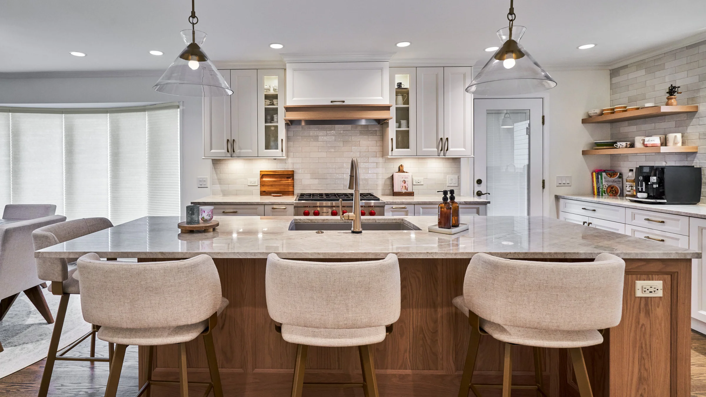 Arlington Heights kitchen remodel: White cabinets, wood island, marble countertop, modern pendant lights, open shelving.
